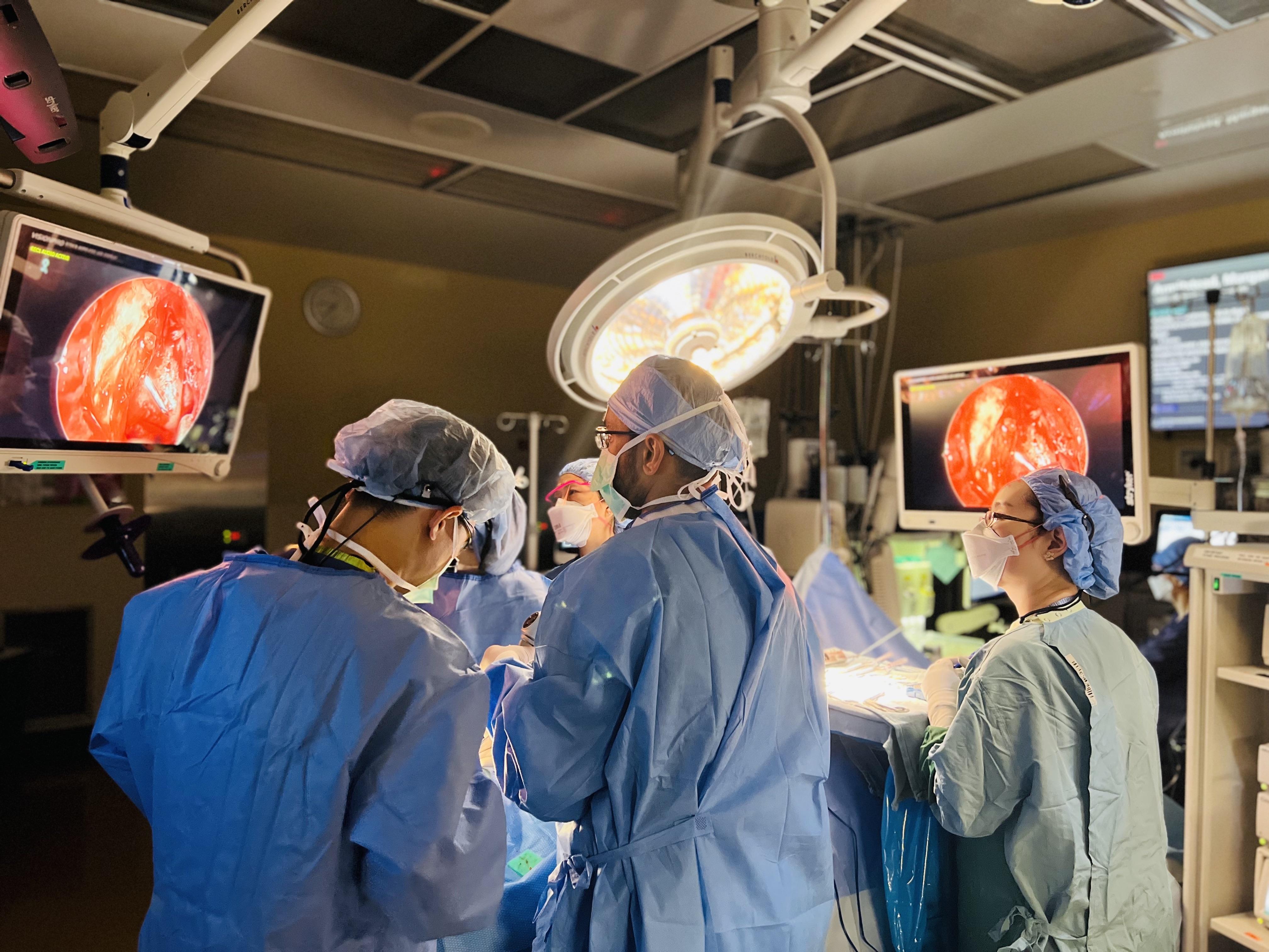 Dr. Sharma performing transnasal endoscopic orbital surgery with Dr. Matthew Zhang, Oculoplastics
